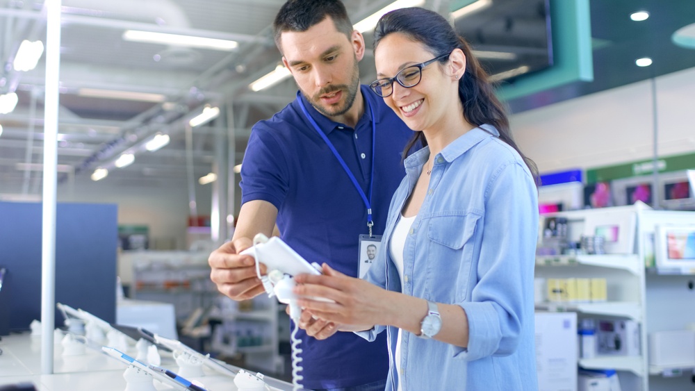 Retail employee assisting a customer
